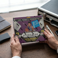 Collector hands displaying 2017-18 Panini Prizm Basketball FOTL Trading Cards on a premium card-shop desk.