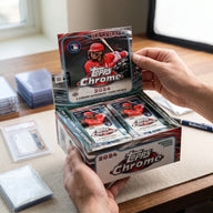 Collector hands displaying 2024 Topps Chrome Baseball Jumbo Hobby Trading Cards on a premium card-shop desk.