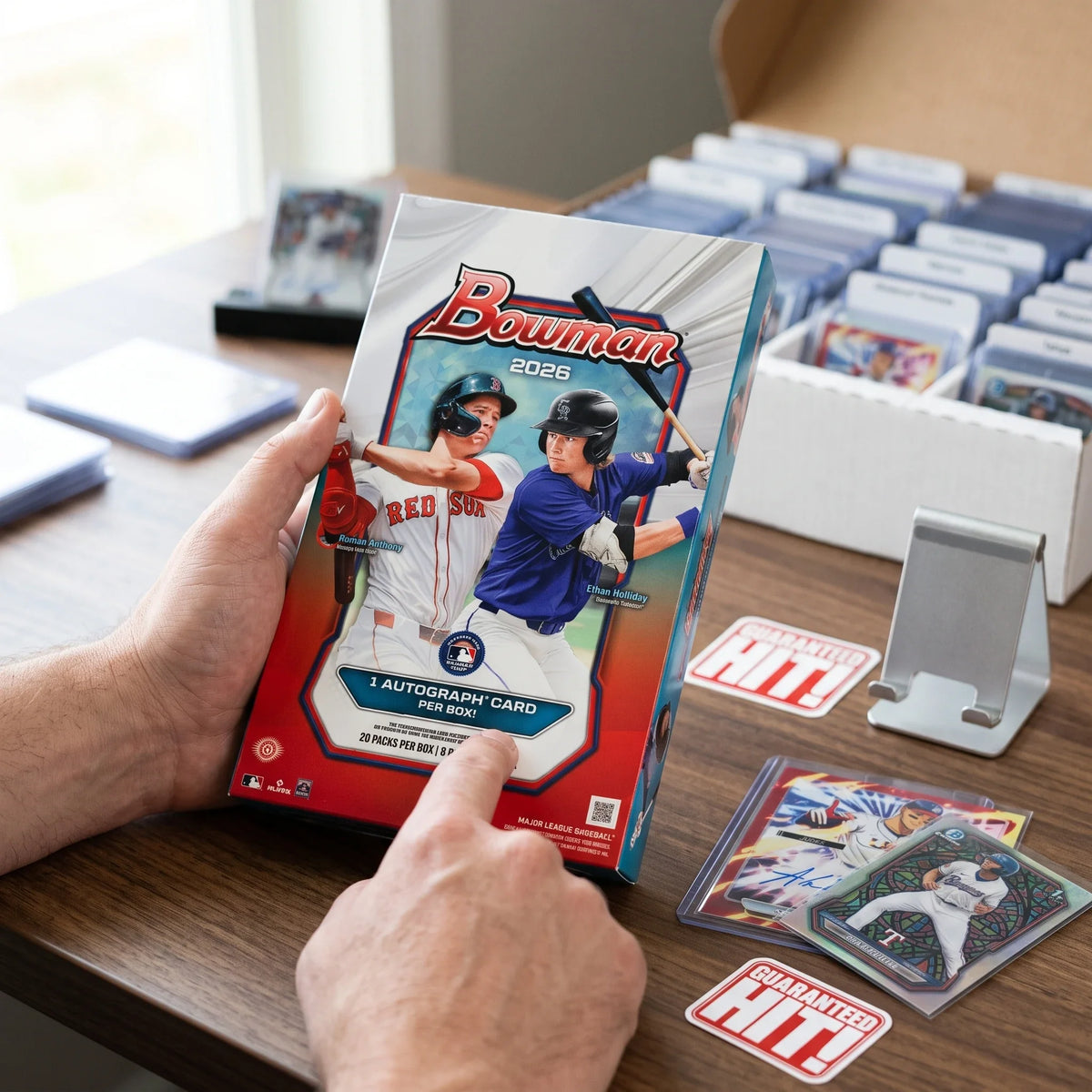 Collector hands displaying RIP TIL YOU HIT | 2026 Bowman Baseball Hobby | 1st Bowman Chase on a premium card-shop desk.